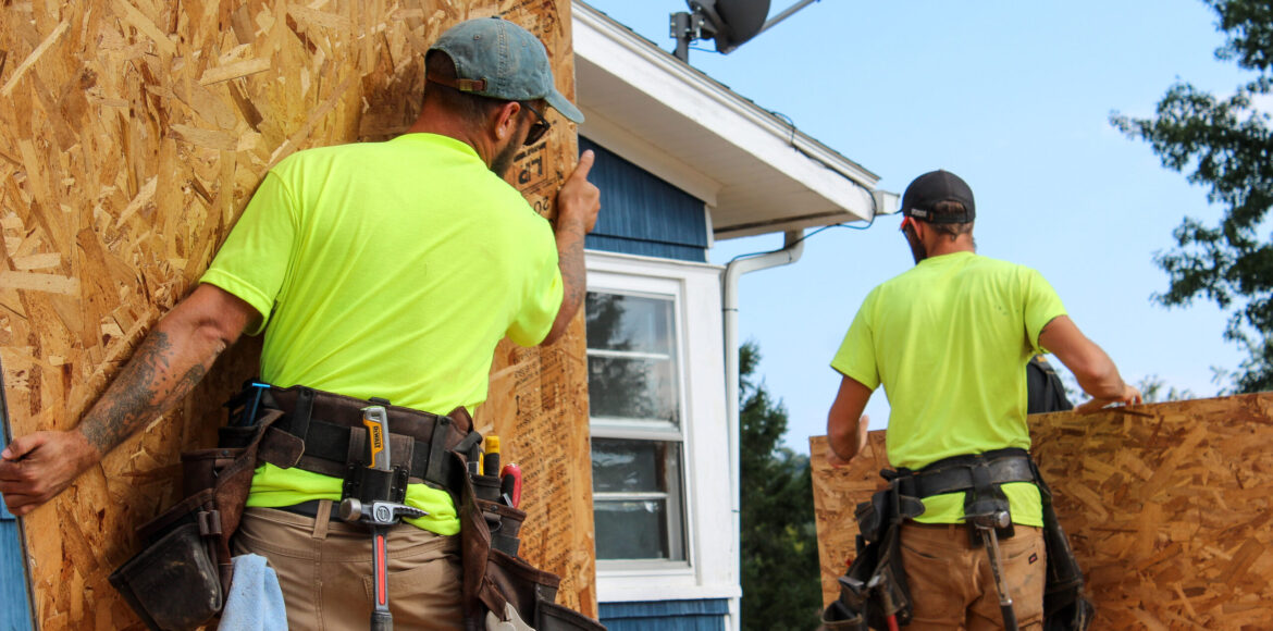 Men Constructing Home Addition: Woodwork in Progress