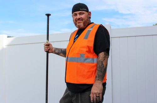 Construction Worker with Tool at Job Site